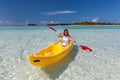 Young caucasian woman kayaking in sea Royalty Free Stock Photo