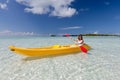 Young caucasian woman kayaking in sea at Maldives Royalty Free Stock Photo