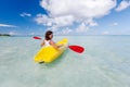 Young caucasian woman kayaking in sea at Maldives Royalty Free Stock Photo