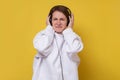 Young caucasian woman listening music with disgust. Royalty Free Stock Photo