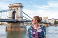 Young Caucasian woman looking away at Chain Bridge, Budapest, Hungary Royalty Free Stock Photo