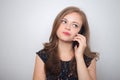 Young caucasian woman with mobile phone looks annoyed, irritated or moody Royalty Free Stock Photo