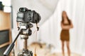 Young caucasian woman model having photo shooting photo studio