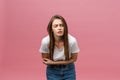 Young caucasian woman over isolated background with hand on stomach because indigestion, painful illness feeling unwell Royalty Free Stock Photo