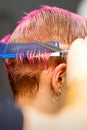 Woman with pink hair getting short haircut Royalty Free Stock Photo