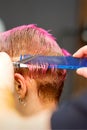 Woman with pink hair getting short haircut Royalty Free Stock Photo