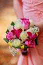 young caucasian woman in pink lace dress holds a bouquet Royalty Free Stock Photo