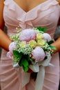 young caucasian woman in pink lace dress holds a bouquet Royalty Free Stock Photo