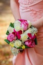 young caucasian woman in pink lace dress holds a bouquet Royalty Free Stock Photo