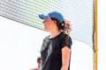 Young caucasian woman playing beach volleyball standing next to the net Royalty Free Stock Photo