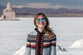 Young caucasian woman portrait. Female traveling girl happy and smiling in white salt flat Uyuni, Bolivia