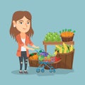 Young caucasian woman pushing a supermarket cart.