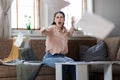 Young Caucasian woman screams and throws documents into camera. Business and mortgage concept Royalty Free Stock Photo