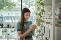 A Caucasian woman is shopping for organic products in a refill retail store Royalty Free Stock Photo