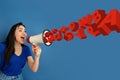 Woman shouting with megaphone, loudspeaker on studio background. Sales, offer, business, cheering fun concept.