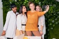 Young caucasian woman take selfie with her colleagues Royalty Free Stock Photo