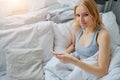 Young caucasian woman use smartphone in morning Royalty Free Stock Photo