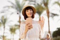 Young caucasian woman using smartphone on a beautiful tropical view at luxury hotel. Royalty Free Stock Photo