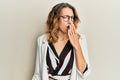 Young caucasian woman wearing business style and glasses bored yawning tired covering mouth with hand Royalty Free Stock Photo