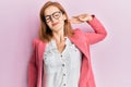 Young caucasian woman wearing business style and glasses stretching back, tired and relaxed, sleepy and yawning for early morning Royalty Free Stock Photo