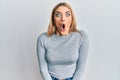 Young caucasian woman wearing casual clothes afraid and shocked with surprise expression, fear and excited face Royalty Free Stock Photo