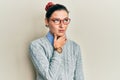 Young caucasian woman wearing casual clothes and glasses touching painful neck, sore throat for flu, clod and infection