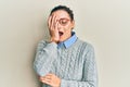 Young caucasian woman wearing casual clothes and glasses yawning tired covering half face, eye and mouth with hand Royalty Free Stock Photo