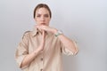 Young caucasian woman wearing casual shirt doing time out gesture with hands, frustrated and serious face Royalty Free Stock Photo