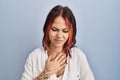 Young caucasian woman wearing casual white shirt over isolated background with hand on stomach because indigestion, painful Royalty Free Stock Photo