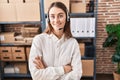 Young caucasian woman working at small business ecommerce wearing headset happy face smiling with crossed arms looking at the Royalty Free Stock Photo