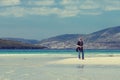 Young Caucassian woman on a white sandy beach in Luskentyre, Isle of Harris, Scotland