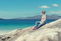 Young Caucassian woman on a white sandy beach in Luskentyre, Isle of Harris, Scotland