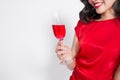 Young celebrating beautiful asian woman in red dress holding win Royalty Free Stock Photo