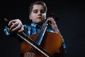 Young Cellist playing classical music on cello