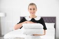 Young chambermaid with clean towels Royalty Free Stock Photo