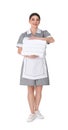 Young chambermaid holding stack of fresh towels on background Royalty Free Stock Photo