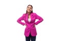 young charismatic successful brunette business lady is dressed in a bright crimson jacket on a white background