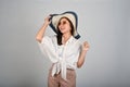 A young charming Asian woman wearing hat, white  background Royalty Free Stock Photo