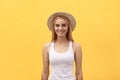 Young charming blond woman with happy exited emotional face looking at camera, over yellow background Royalty Free Stock Photo