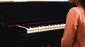 Young charming brunette girl playing the piano Generated Image