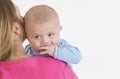 Young cheerfl mother holding a baby boy in her arms Royalty Free Stock Photo