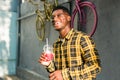 Young cheerful african american male on city having fun and holding cocktail. Man on summer holiday. Leisure lifestyle Royalty Free Stock Photo