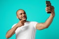 Young cheerful african american man taking selfie picture Royalty Free Stock Photo