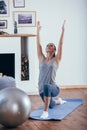 Young cheerful attractive woman practicing yoga Royalty Free Stock Photo