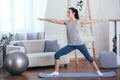 Young cheerful attractive woman practicing yoga