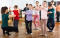 Young ballet dancers exercising in ballroom Royalty Free Stock Photo
