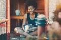 Black smiling girl with digital tablet on veranda Royalty Free Stock Photo