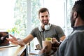 Young cheerful colleagues sitting in office coworking Royalty Free Stock Photo