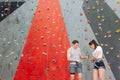 Young cheerful couple at bouldering gym. Royalty Free Stock Photo