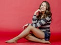 Young cheerful girl in denim shorts and a striped sweater walking in the youthful style Royalty Free Stock Photo